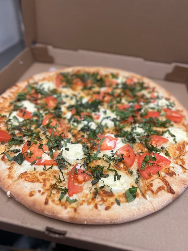 Tomato basil white pizza.